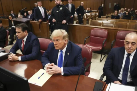 Former president Donald Trump, center, awaits the start of proceedings at Manhattan criminal court, Monday, April 22, 2024, in New York.